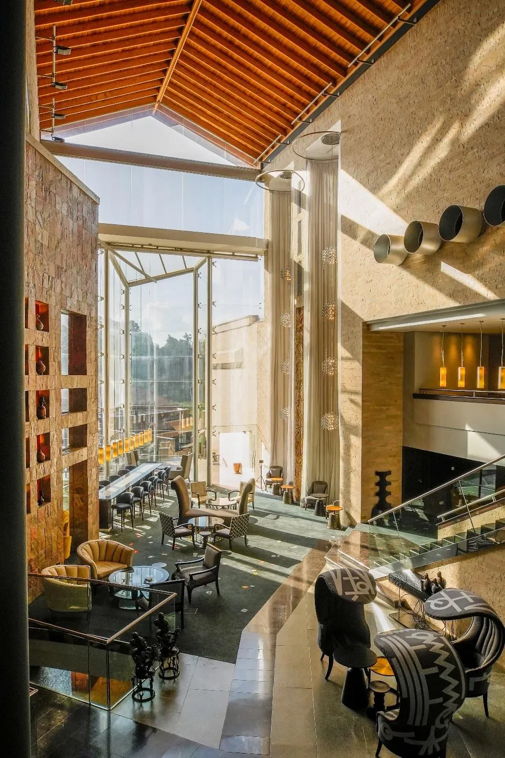 Double-height public space at Tribe Boutique Hotel.